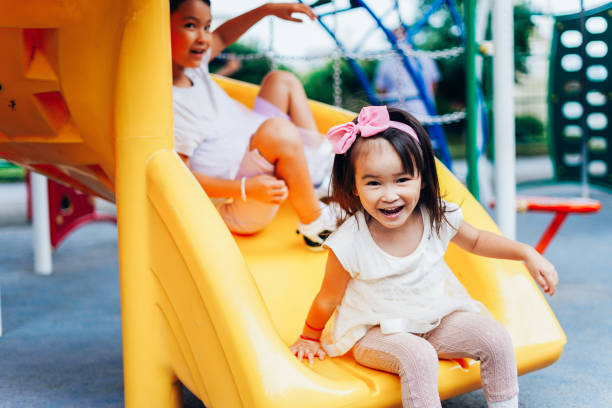 Kids coming down a slide