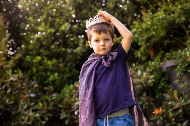 Child in cape and crown